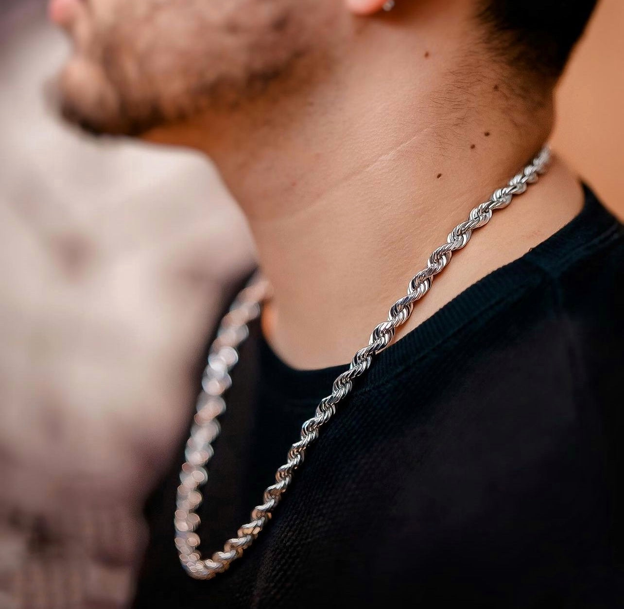 A man in white gold diamond cut rope chain