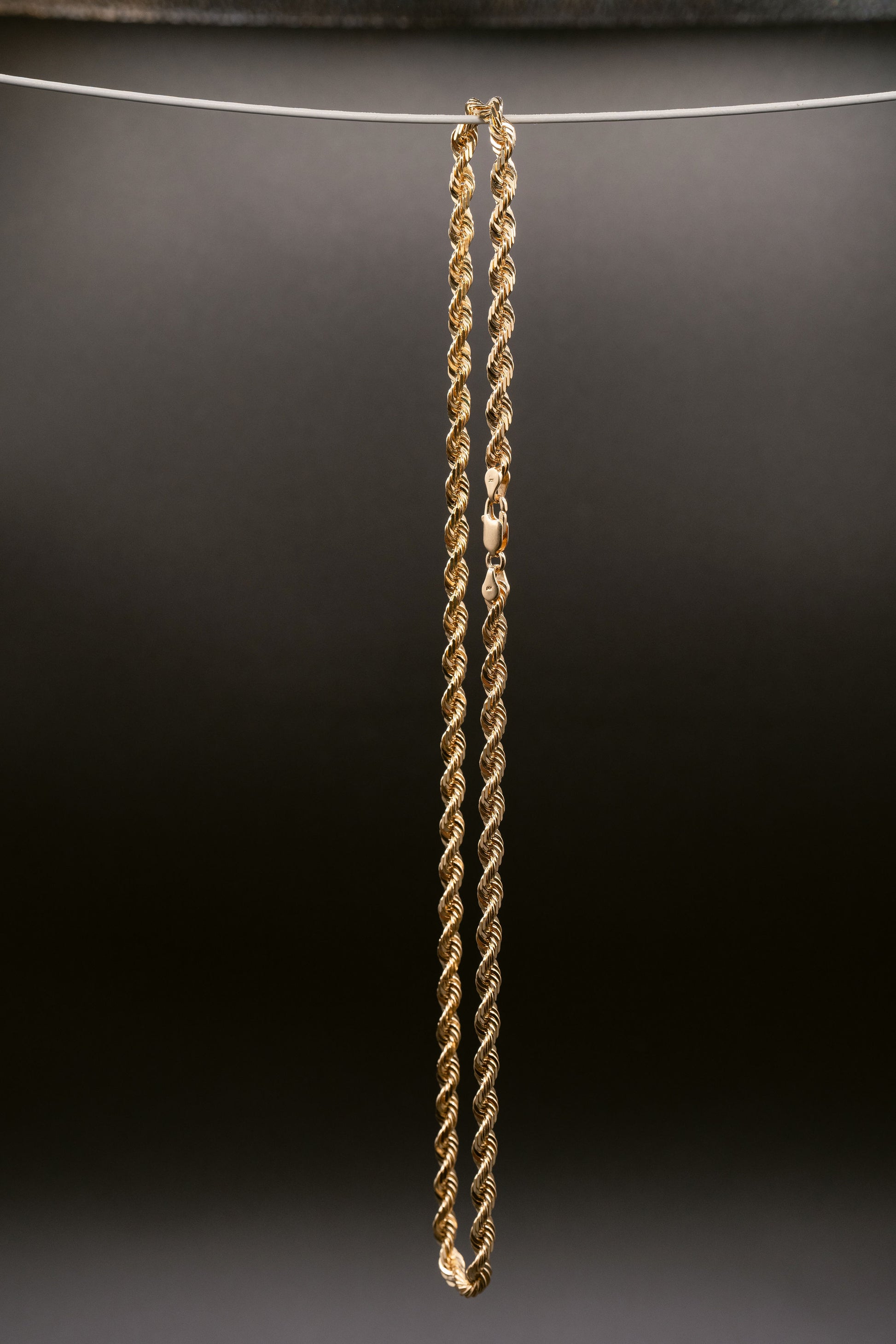 Yellow gold rope chain photographed 