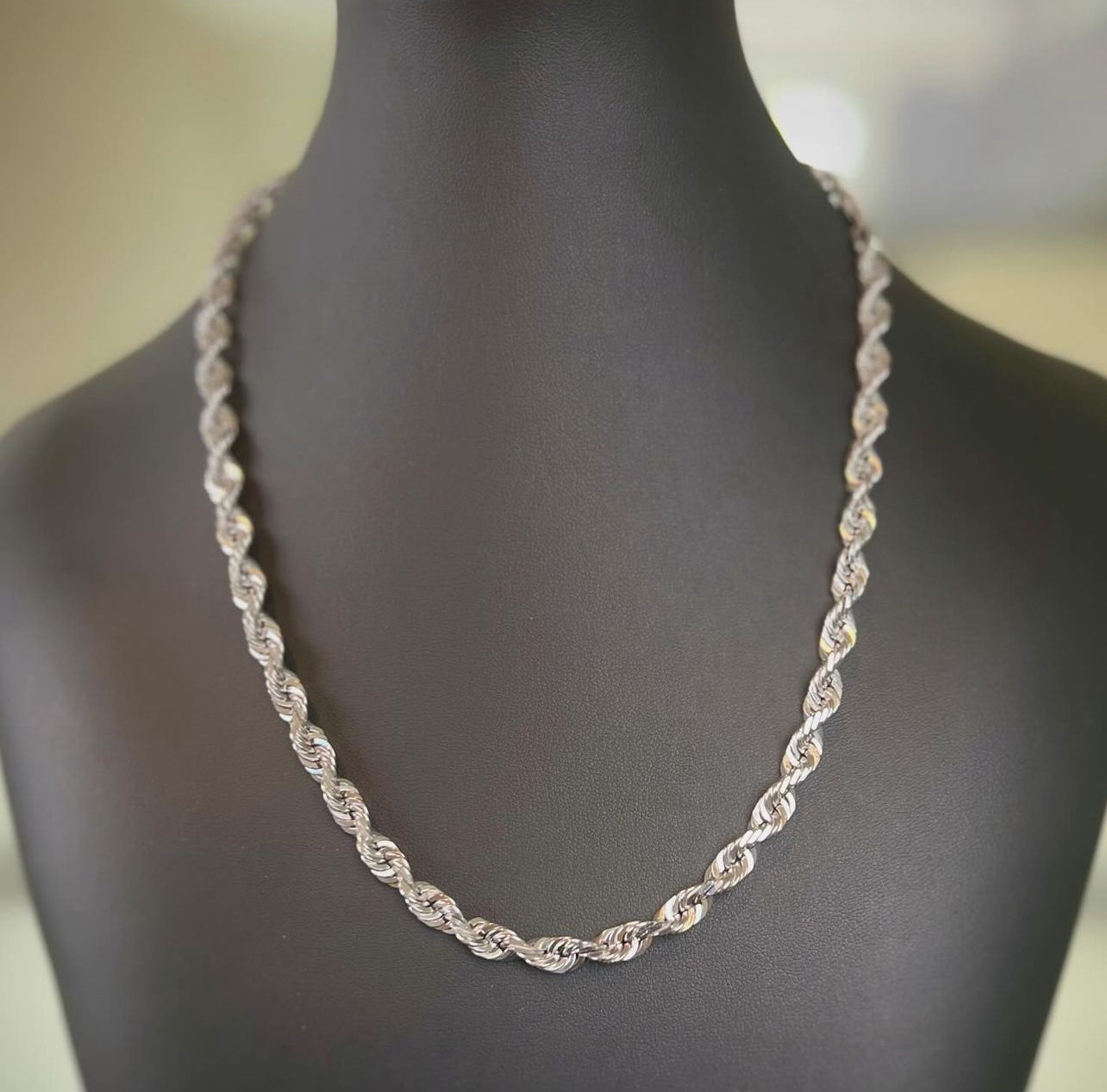 A white gold diamond cut rope chain 