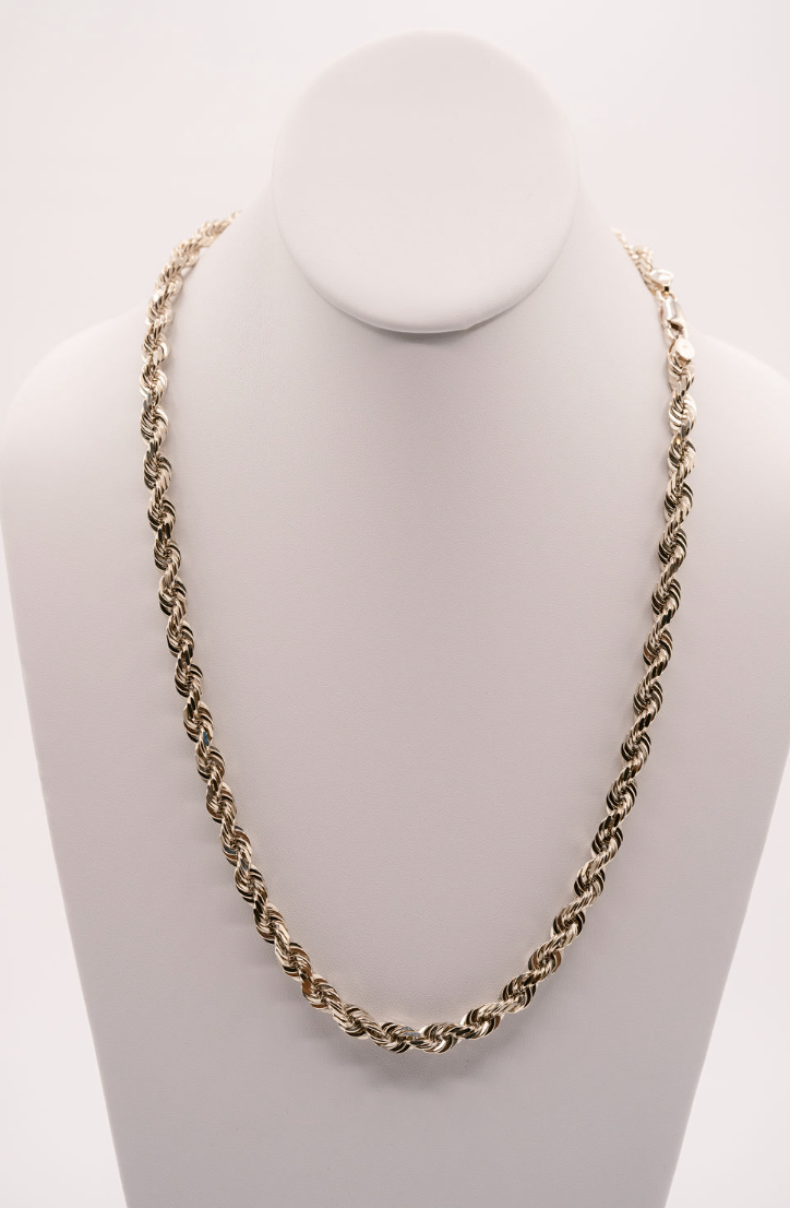 A white gold diamond cut rope chain necklace displayed on a mannequin bust.